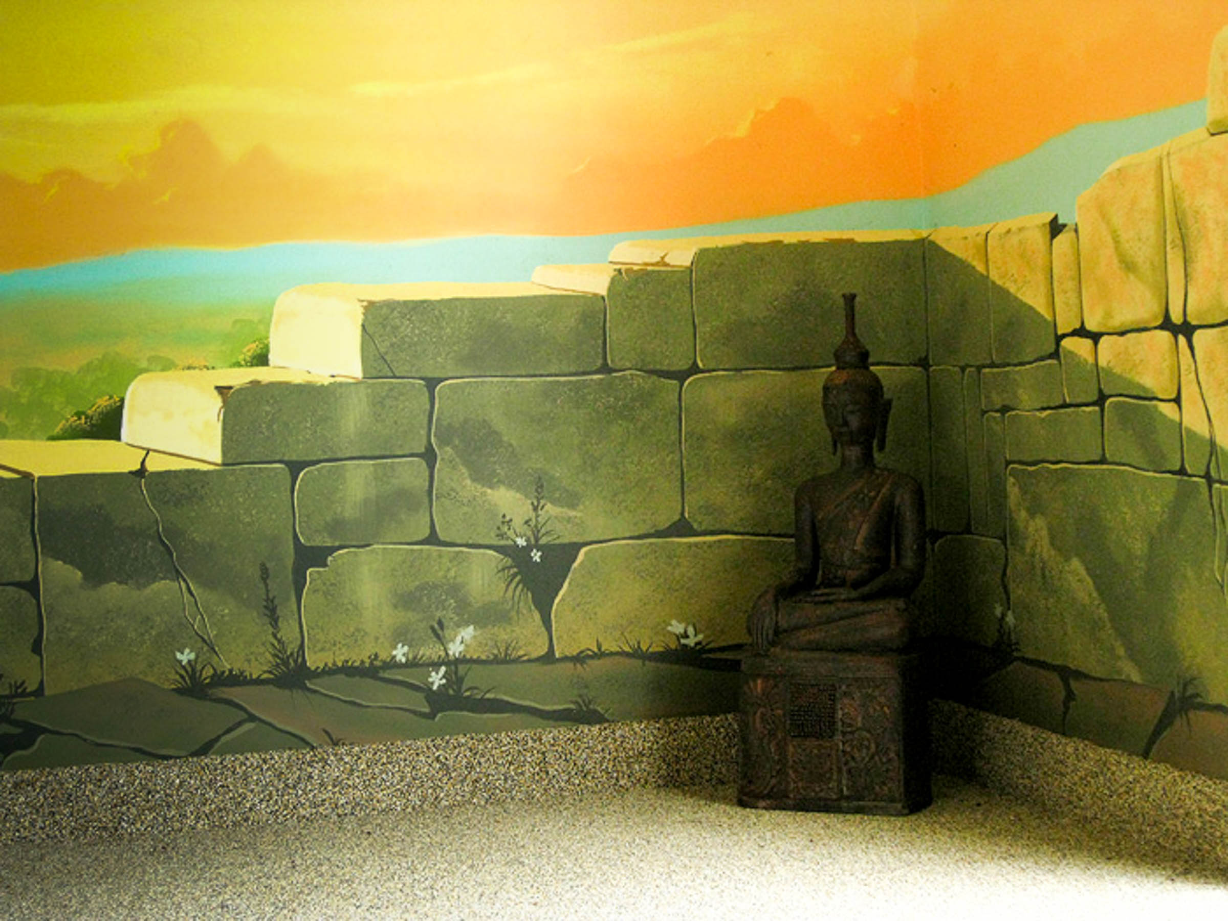 Seated Buddhist statue decorates the corner