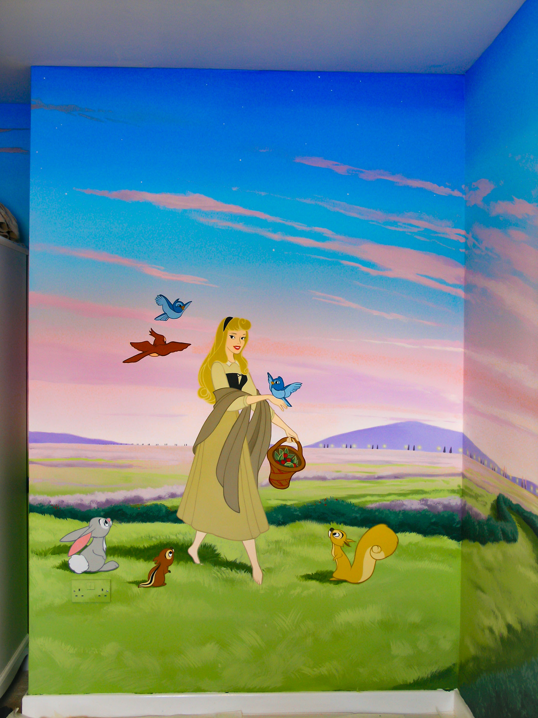 Sleeping Beauty part of mural featuring Aurara and her woodland animal friends