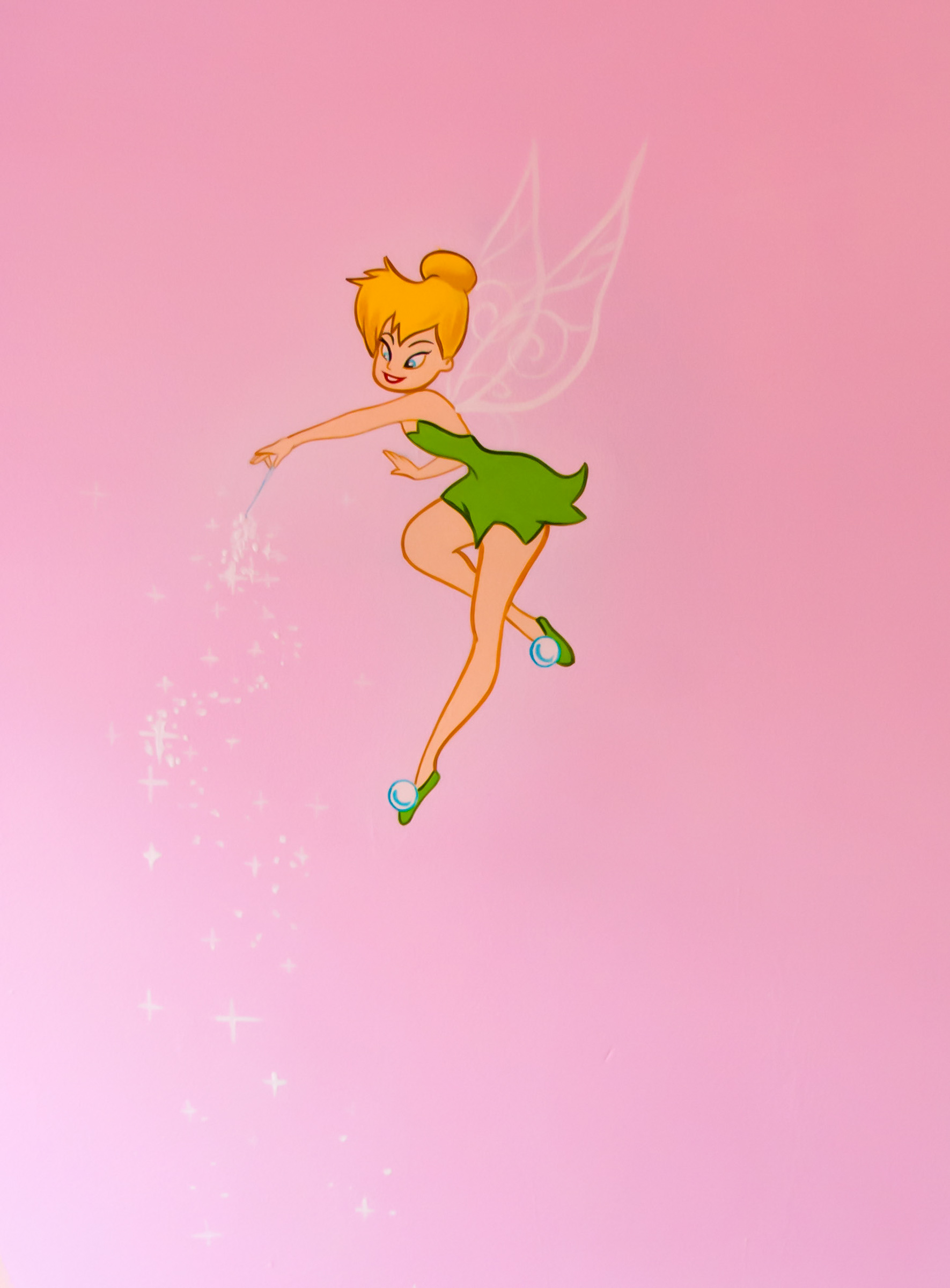 Tinkerbell waving some fairy dust into the room