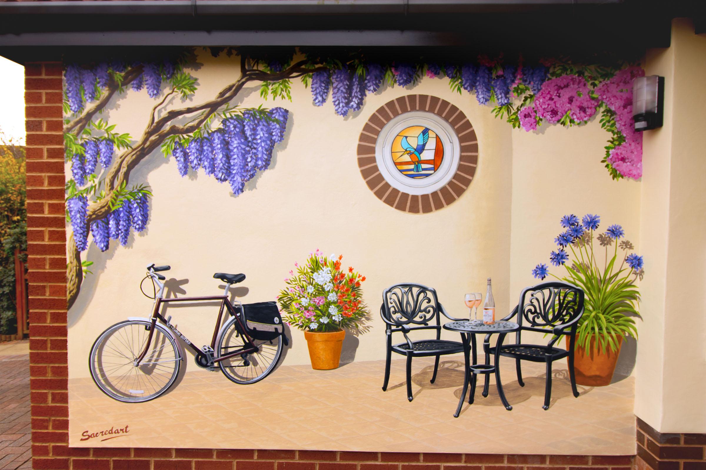 Memories of a cycling holiday destination in France brought home in this exterior mural painted on a garage wall