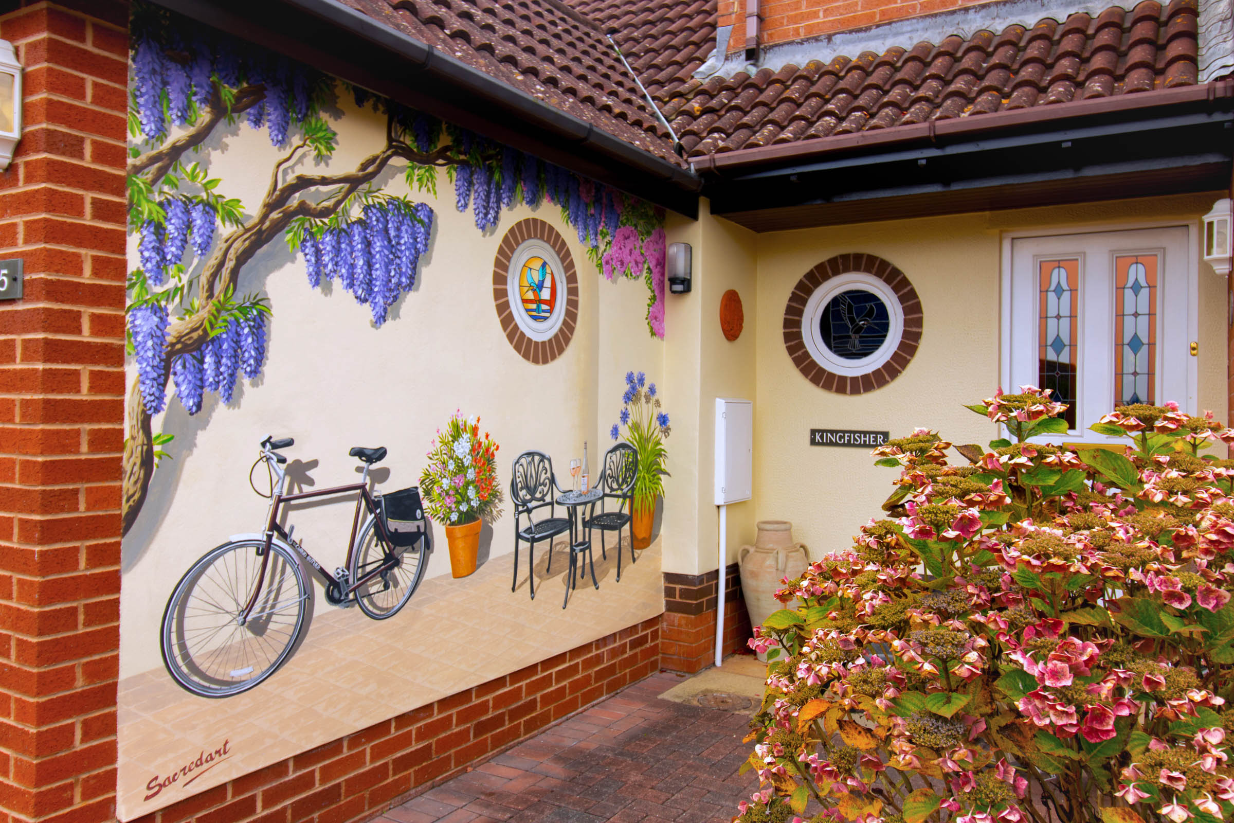 french cycling holiday trompe l'oeil on side of garage