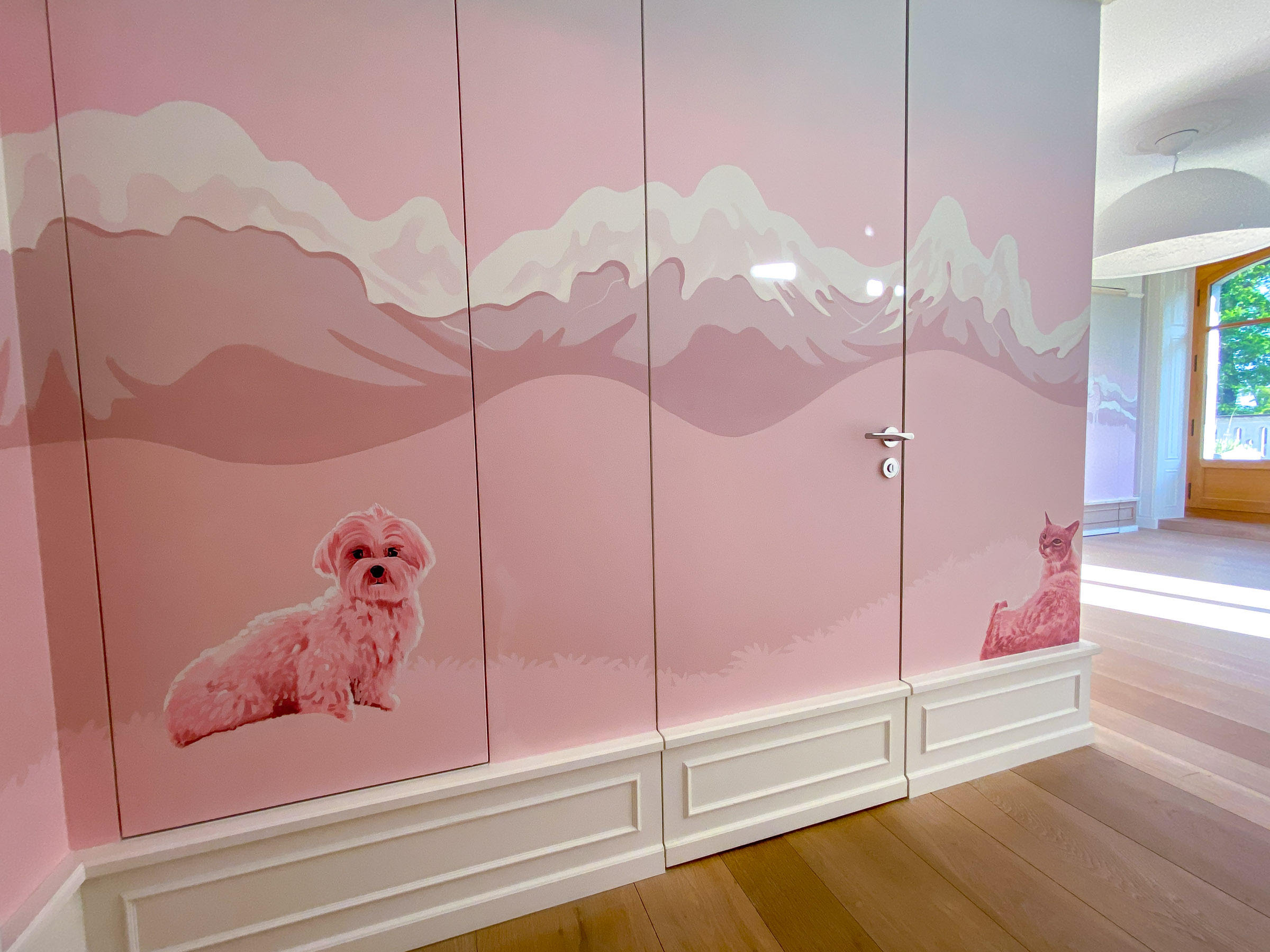 This part of the bedroom mural shows their very cute and fluffy dog, actually painted on a push lock cupboard door