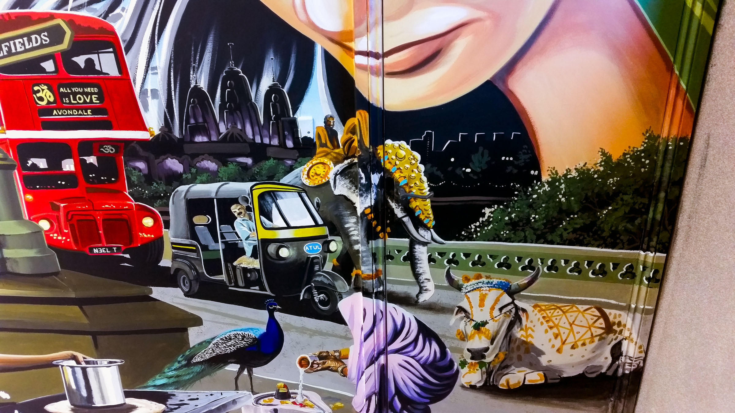This part of the mural shows the organised chaos of an Indian street scene happening in the middle of London