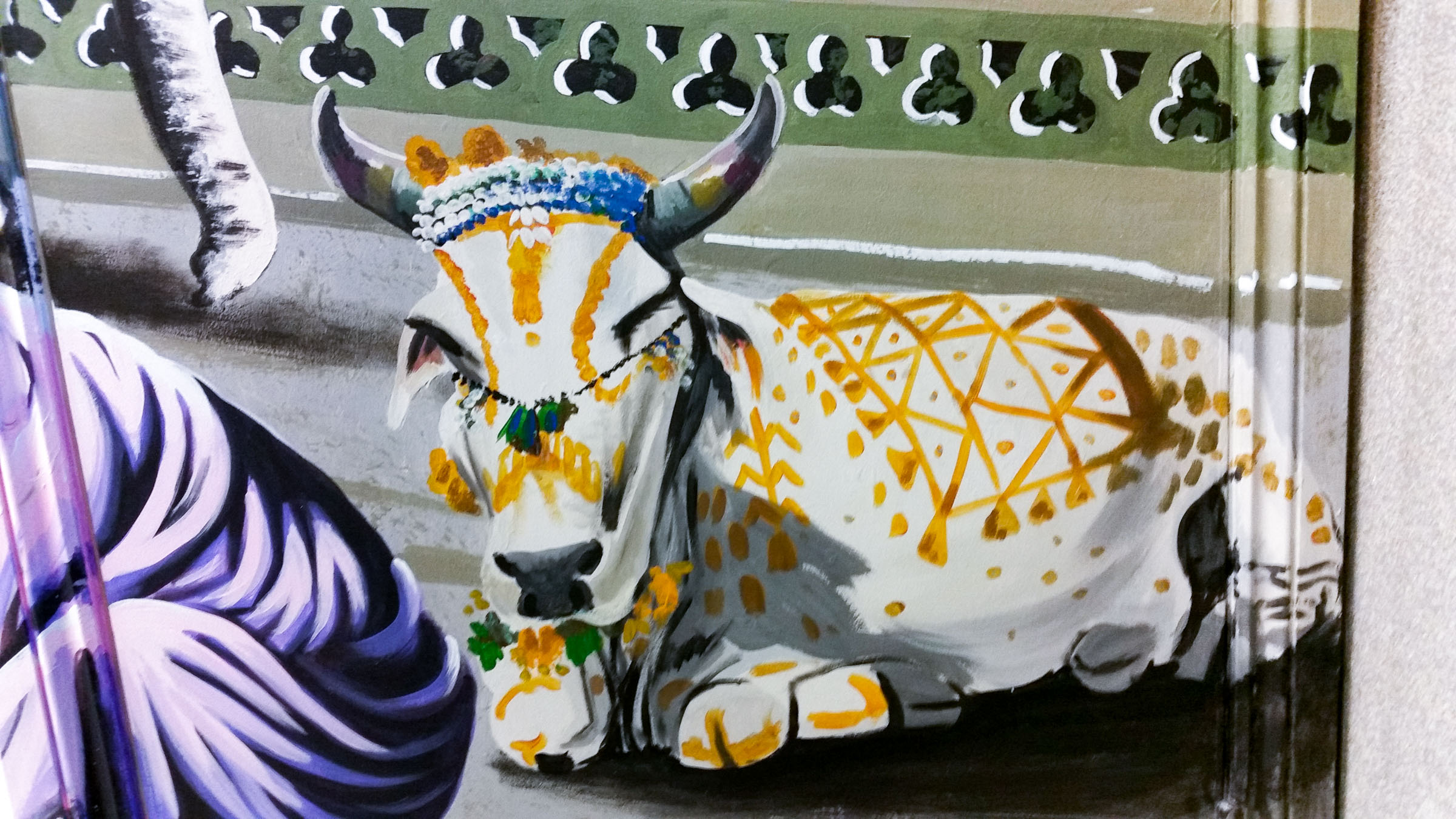 mural of Sacred Cow, blocking the road