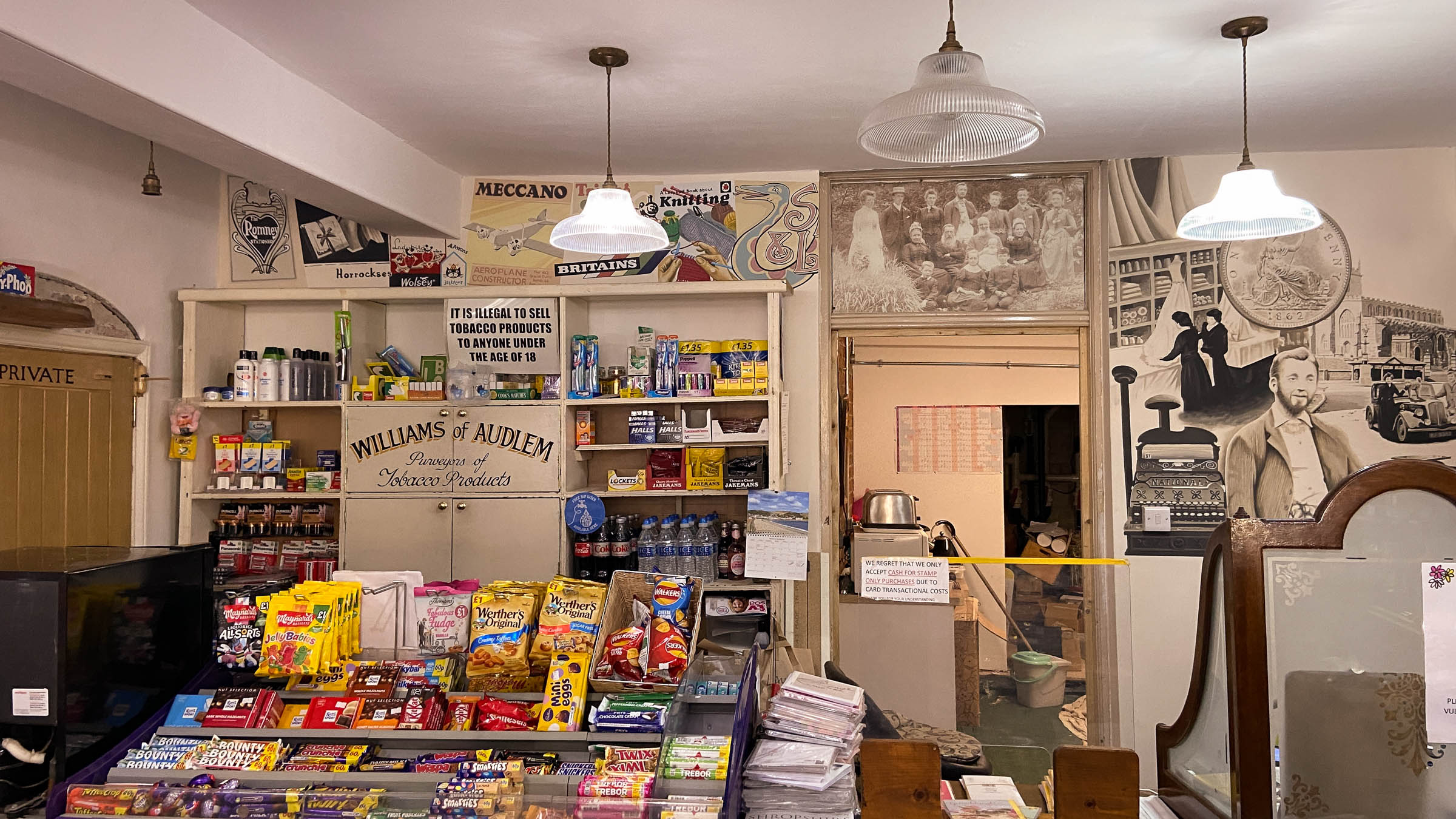 Shows the positioning of the mural on the right, and the old brands painted on above the shelving left.