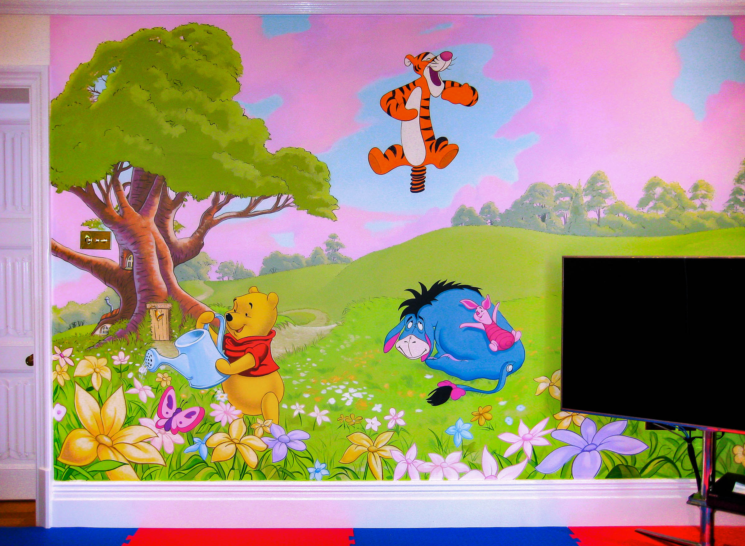 Winnie the pooh mural in playroom
