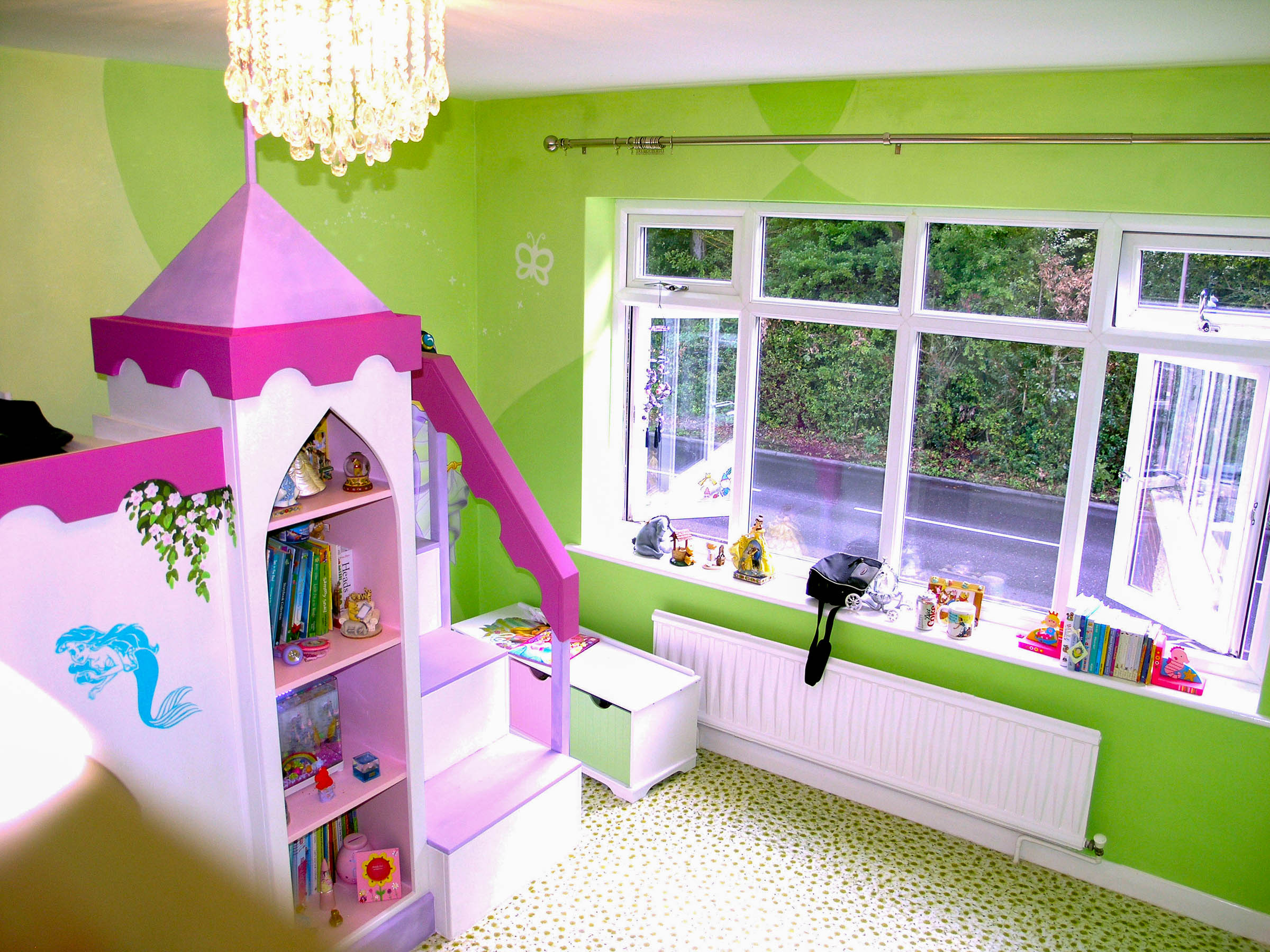 pink fitted castle in girl's green room