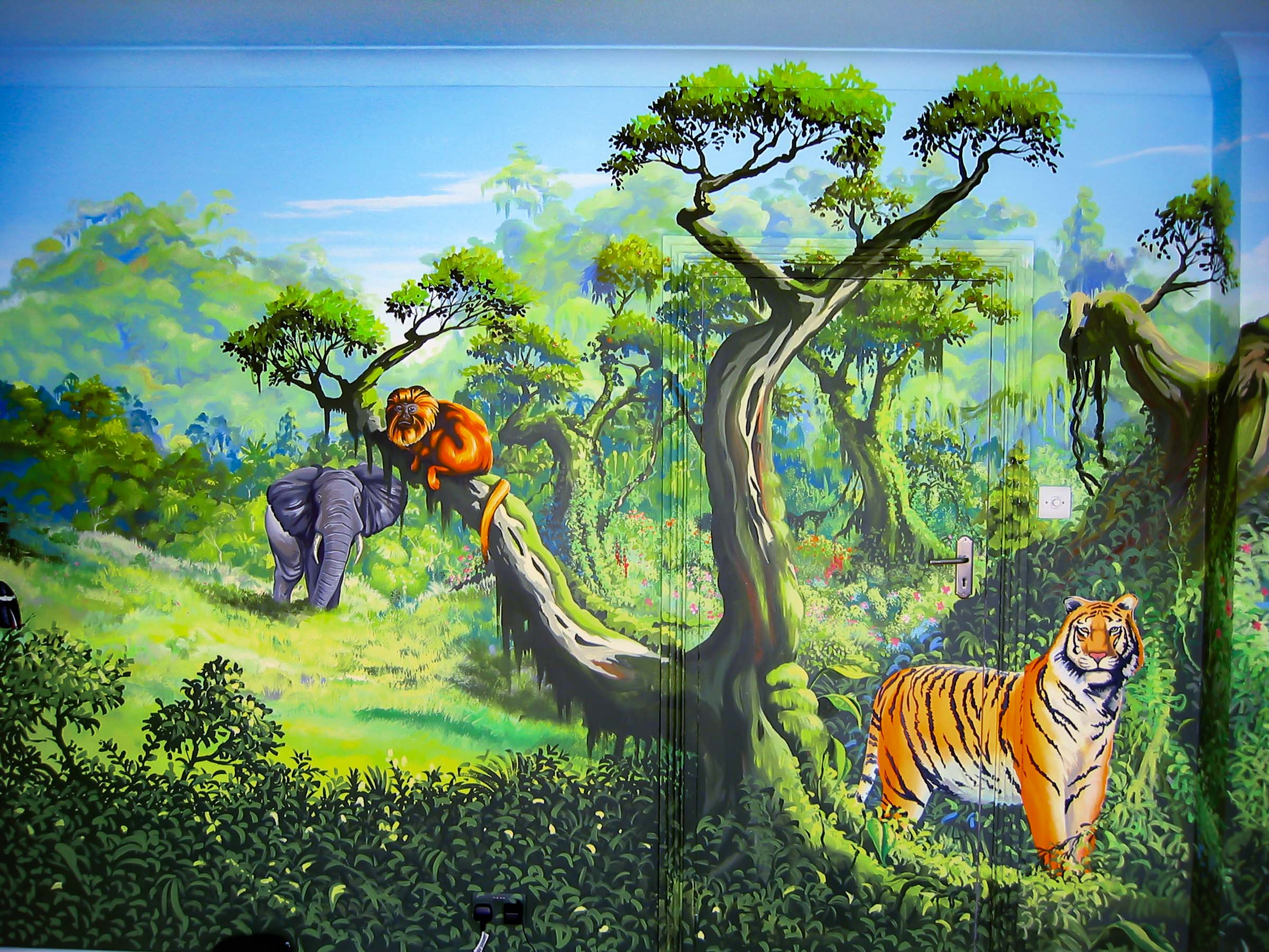 Jungle mural wall opposite the window, with dense jungle, elephant, tiger and golden tamerind
