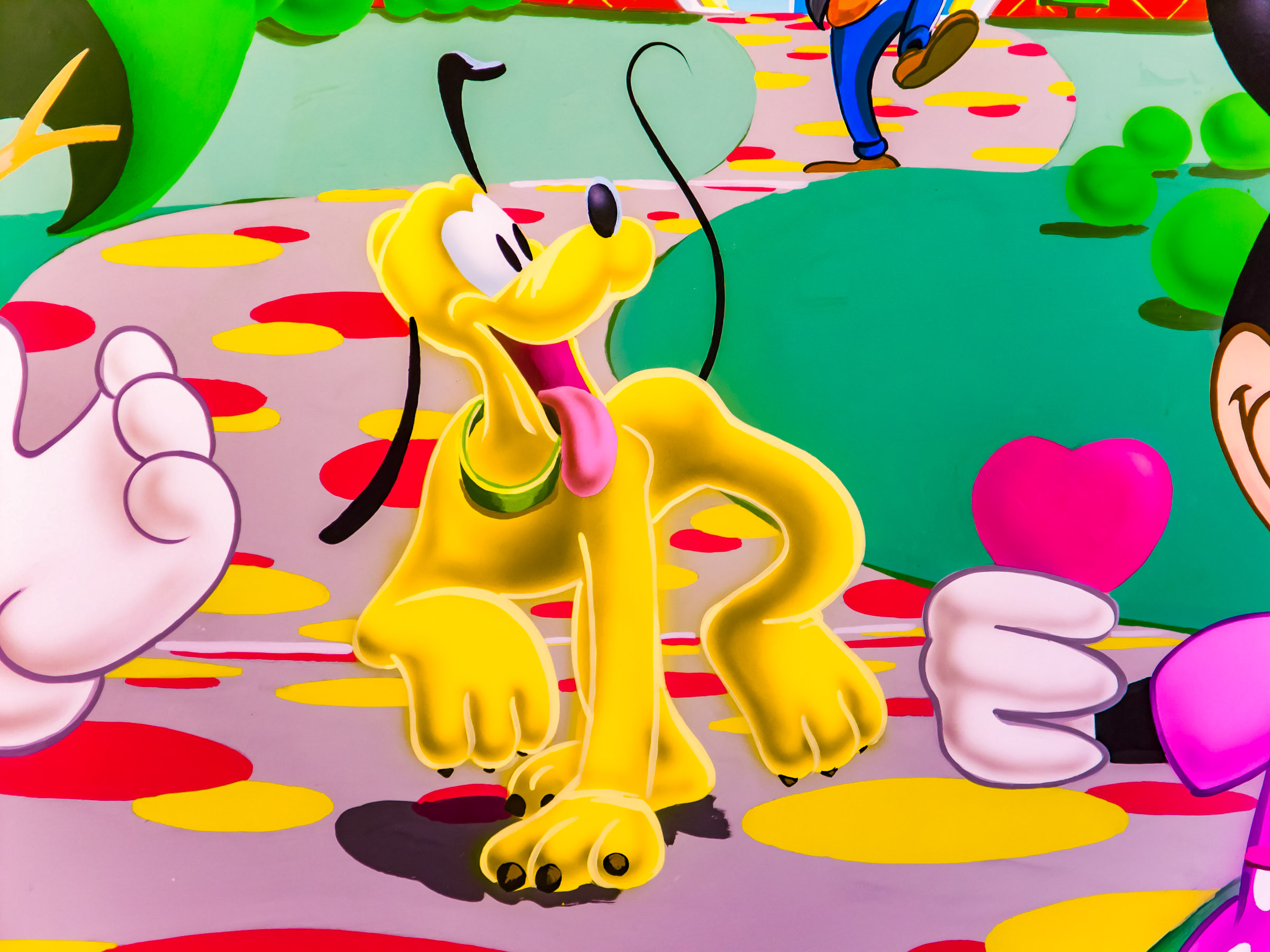 Pluto taking a stroll in this design detail.