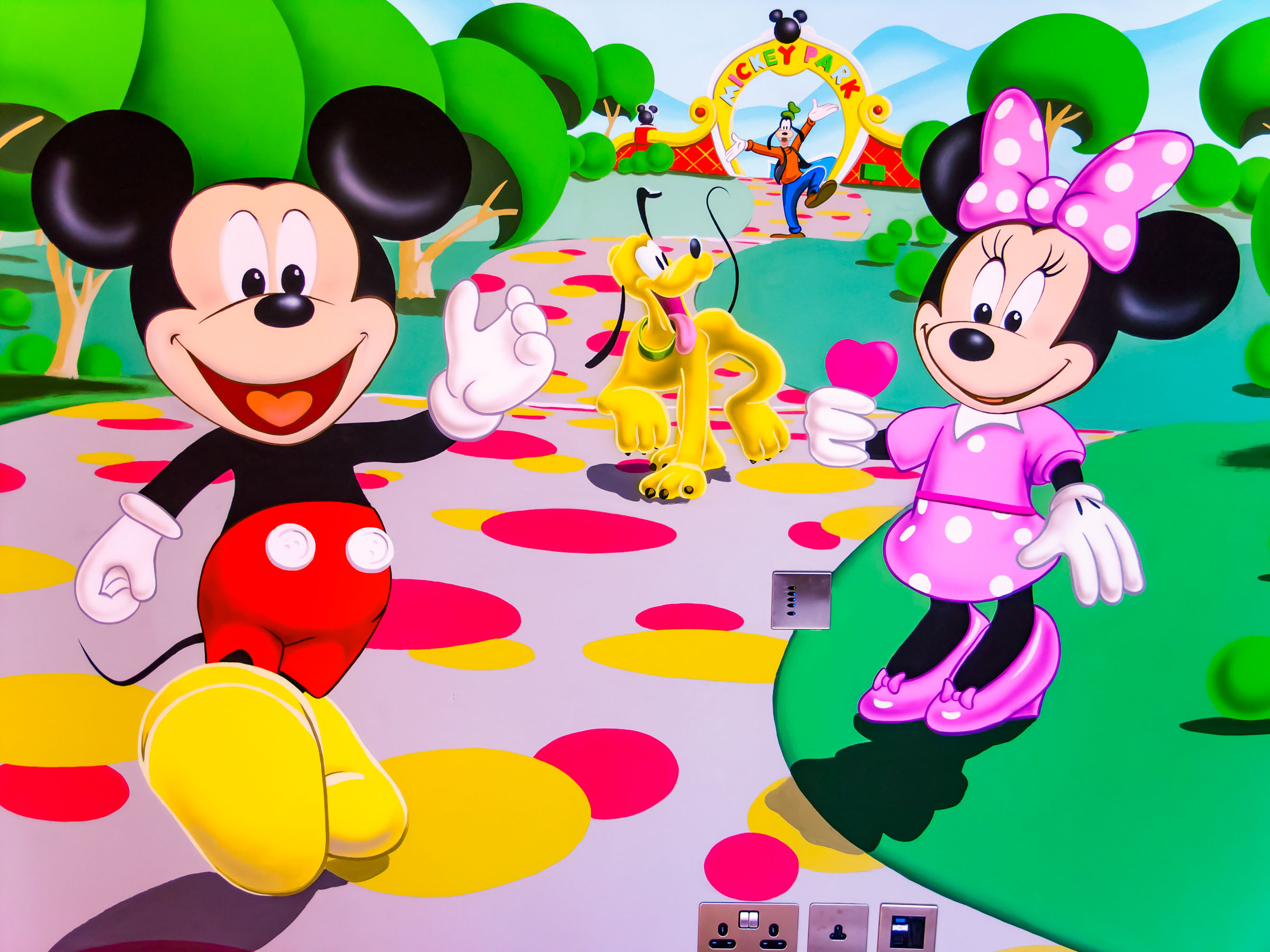 Mickey and Minnie Mouse, Pluto and Goofy in hand painted wall mural